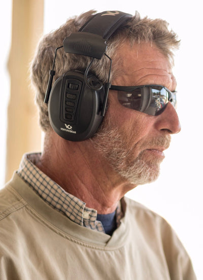 Man wearing Venture Gear Electronic Earmuffs