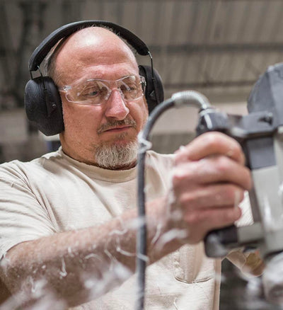 Man wearing Venture Gear Passive Earmuffs