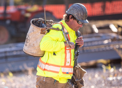 Working wearing Ridgeline Cap Style Hard Hat, Pyramex Work Wear, Venture Gear Eyewear.