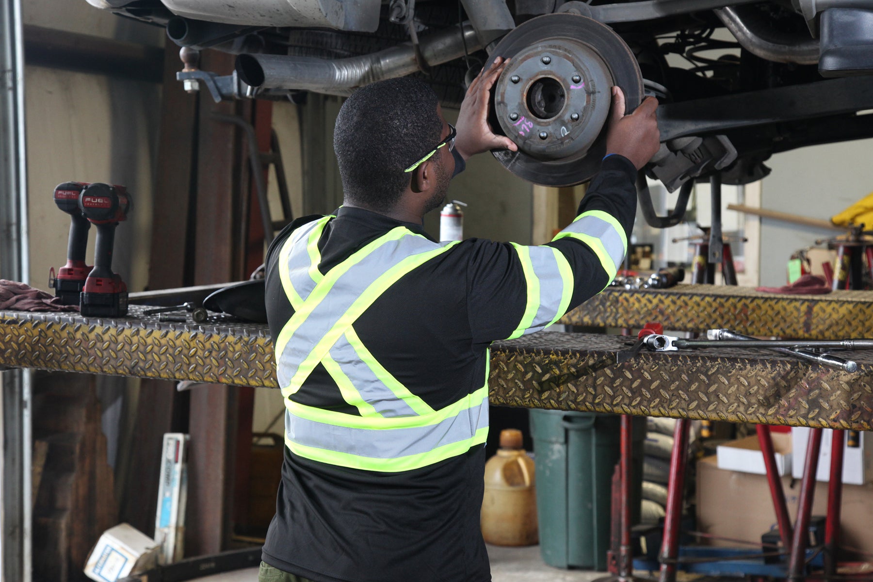 Worker operating on vehicle